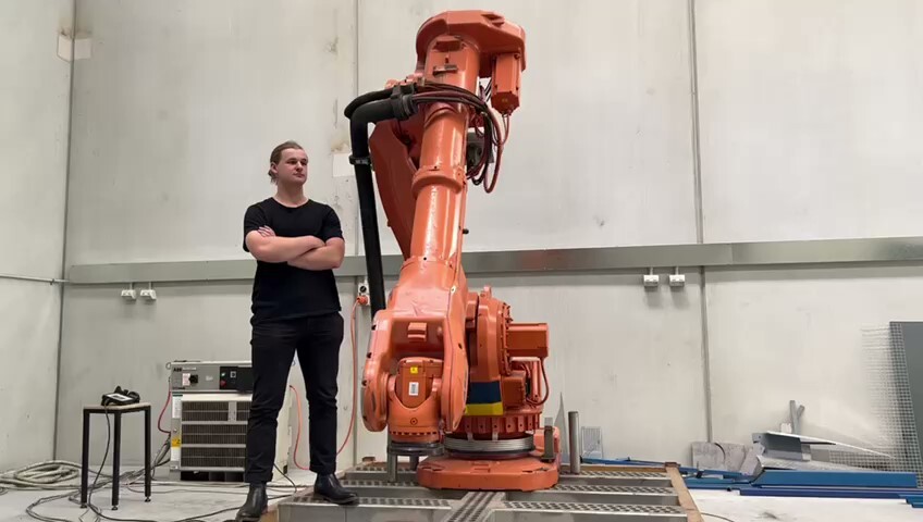 Tom standing beside the Macro3D robot